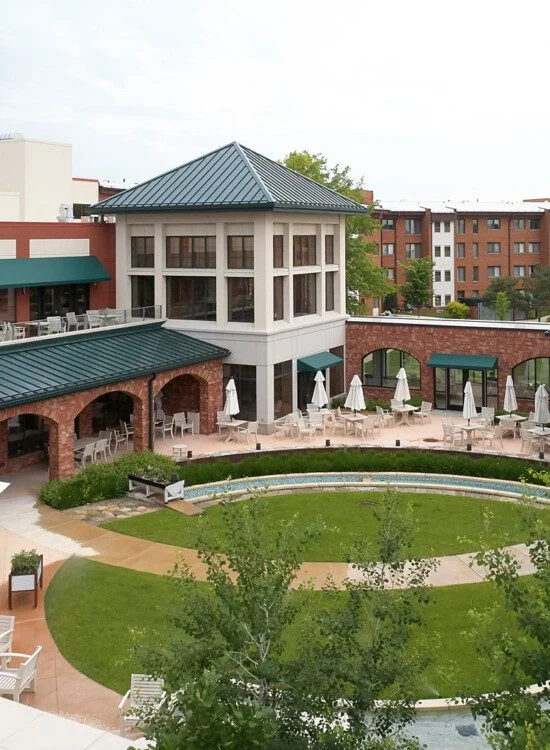 aerial view of courtyard, outdoor dining, and putting green at Beacon Hill Senior Living Community