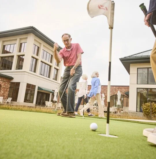 seniors enjoying the putting grounds at Beacon Hill