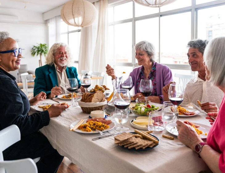 a group of friends enjoying a dinner together in well-appointed settings