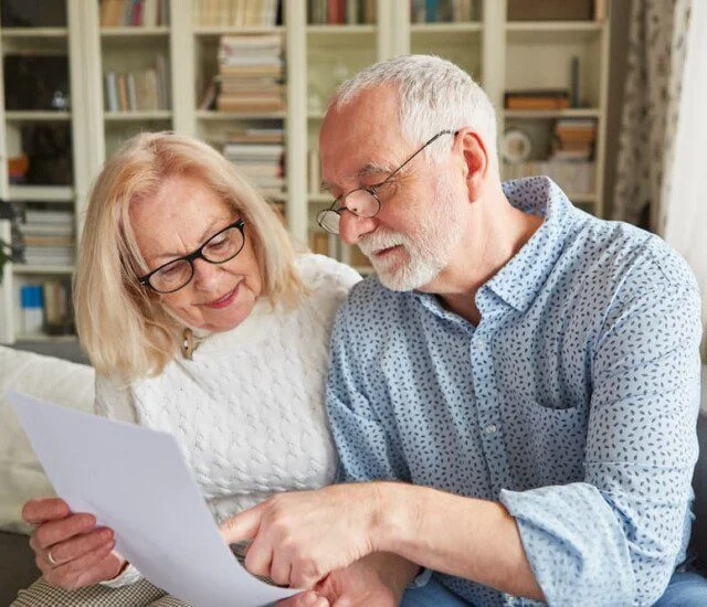 senior couple browsing senior living contracts