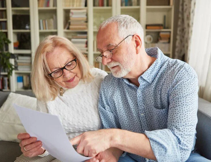 senior couple browsing senior living contracts