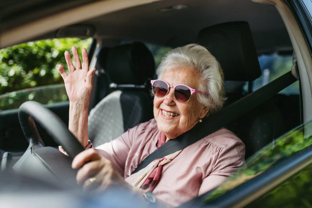 Senior Lady Driving A SUV