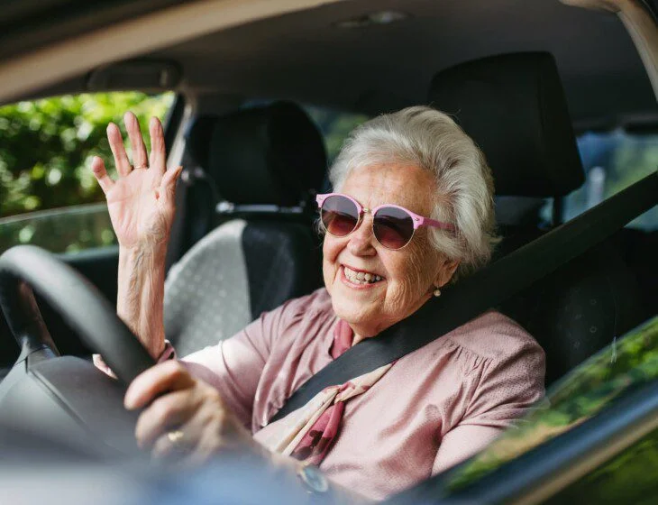 Senior Lady Driving A SUV