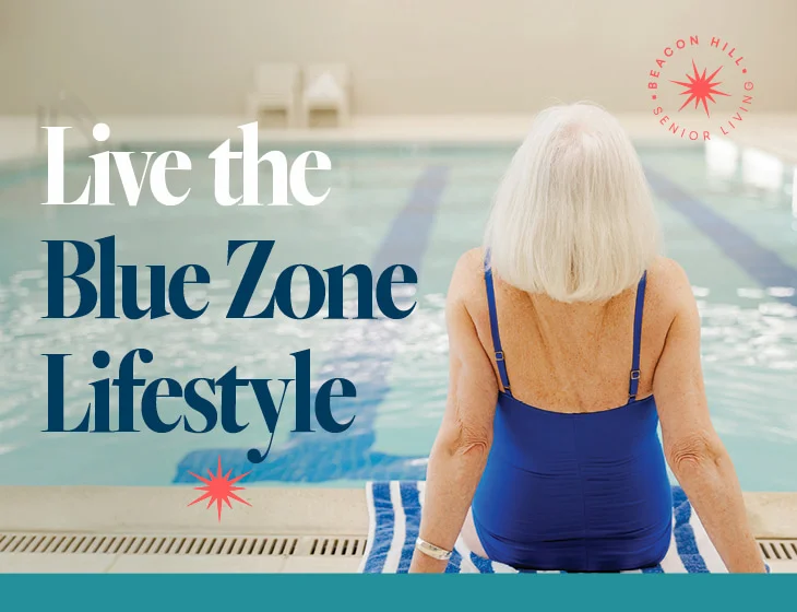 Back of woman in swimsuit sitting on edge of pool looking out over the water with text: Life the Blue Zone Lifestyle.