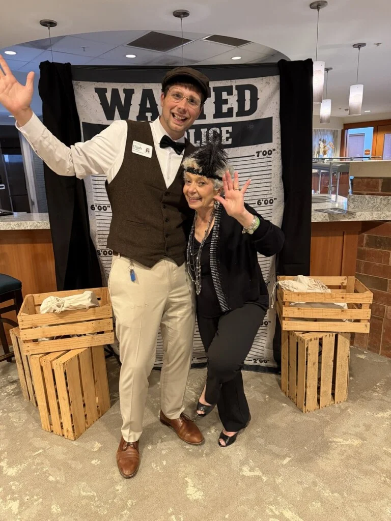 Executive Director Elijah Heyboer with a resident at The Beacon Speakeasy
