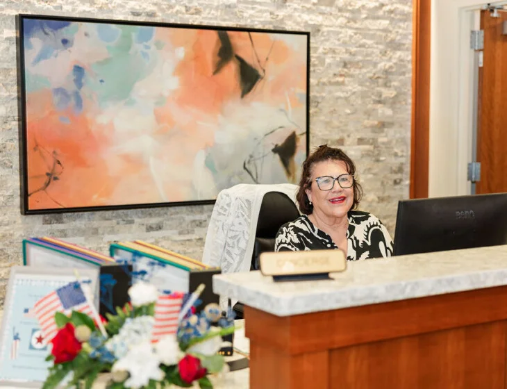 Concierge Sandy Rojas at the front desk at Beacon Hill in Lombard, Illinois