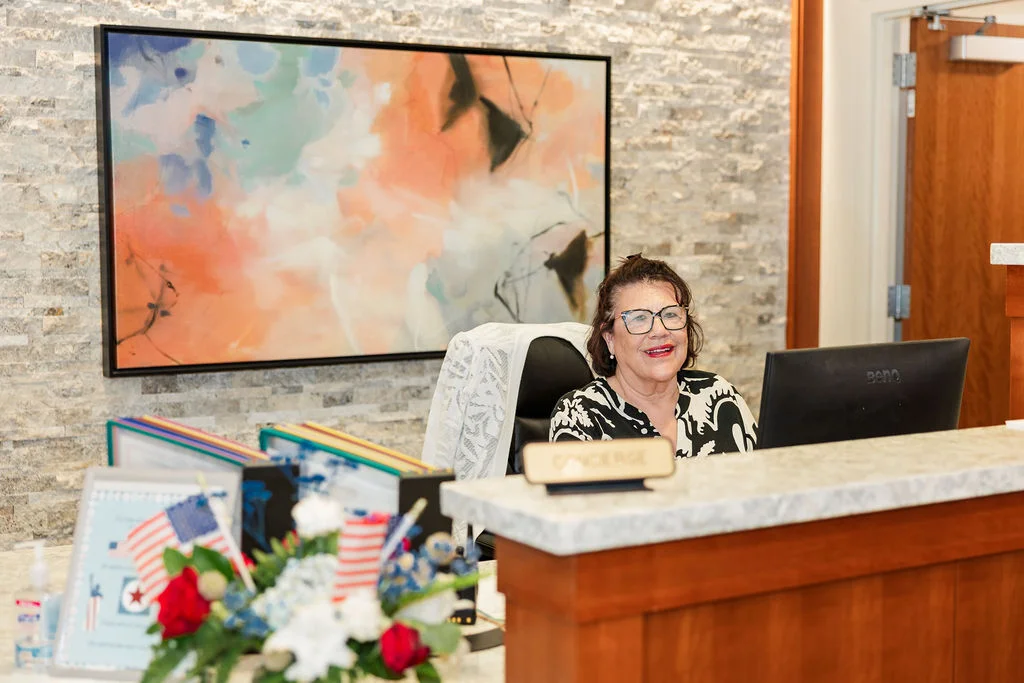 Concierge Sandy Rojas at the front desk at Beacon Hill in Lombard, Illinois
