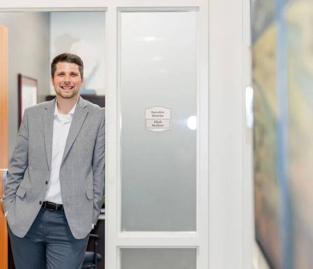 Executive Director Elijah Heyboer outside his office at Beacon Hill in Lombard, Illinois