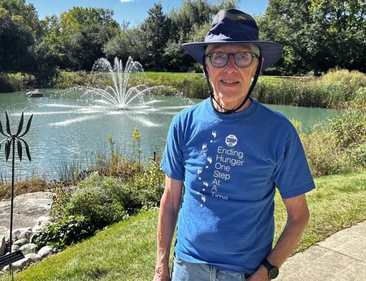 Resident Dan Jares by the pond at Beacon Hill in Lombard, Illinois