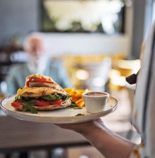close-up of vegetable-filled omelette and breakfast platter
