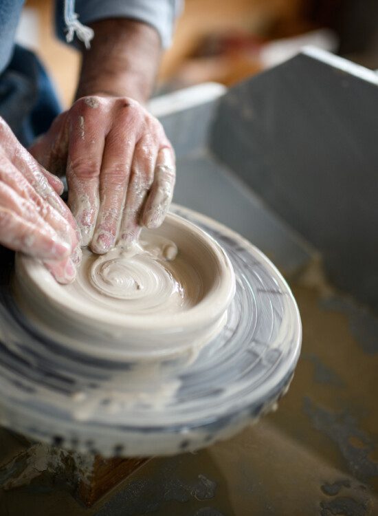 close-up of senior using a pottery wheel