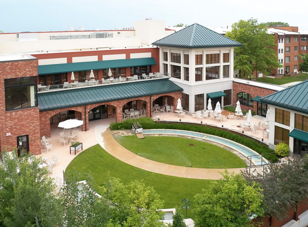 aerial view of courtyard, outdoor dining, and putting green at Beacon Hill Senior Living Community
