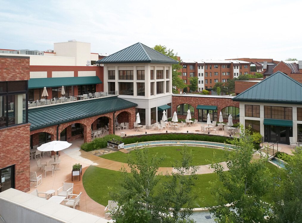 aerial view of courtyard, outdoor dining, and putting green at Beacon Hill Senior Living Community