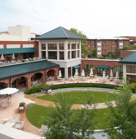 aerial view of courtyard, outdoor dining, and putting green at Beacon Hill Senior Living Community