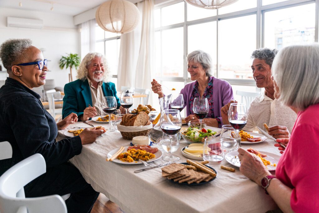 a group of friends enjoying a dinner together in well-appointed settings