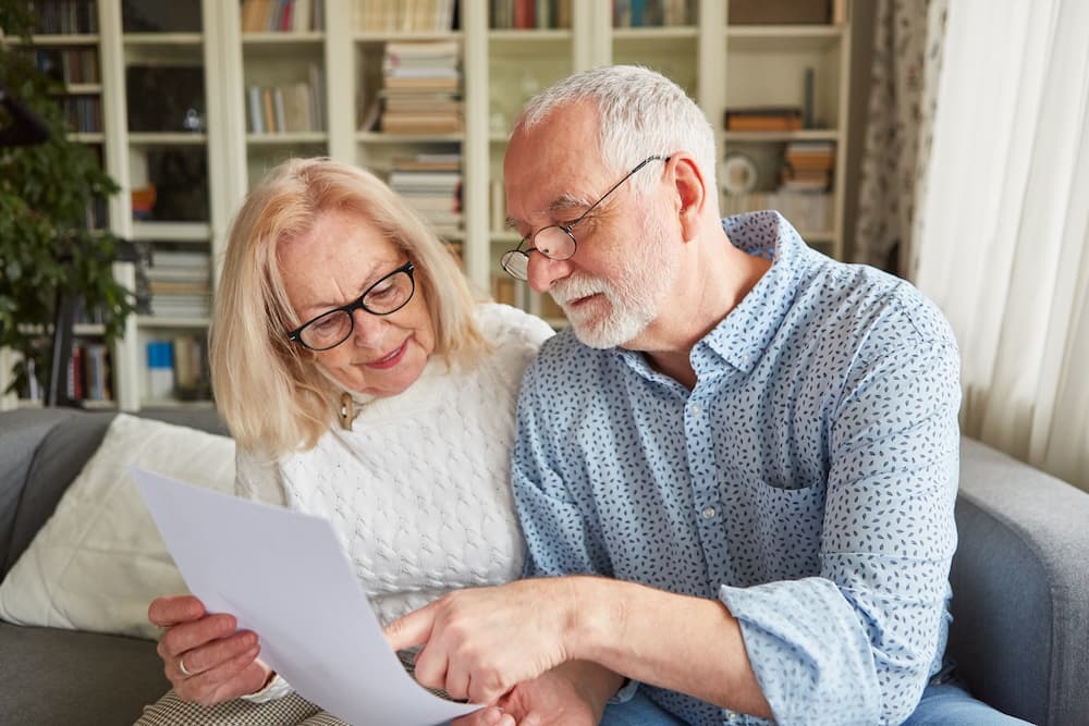 senior couple browsing senior living contracts